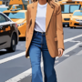 woman walking down 5th avenue nyc